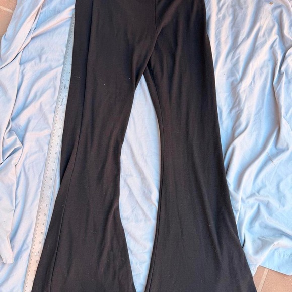 Pants - Black flare pants with ruffle hem